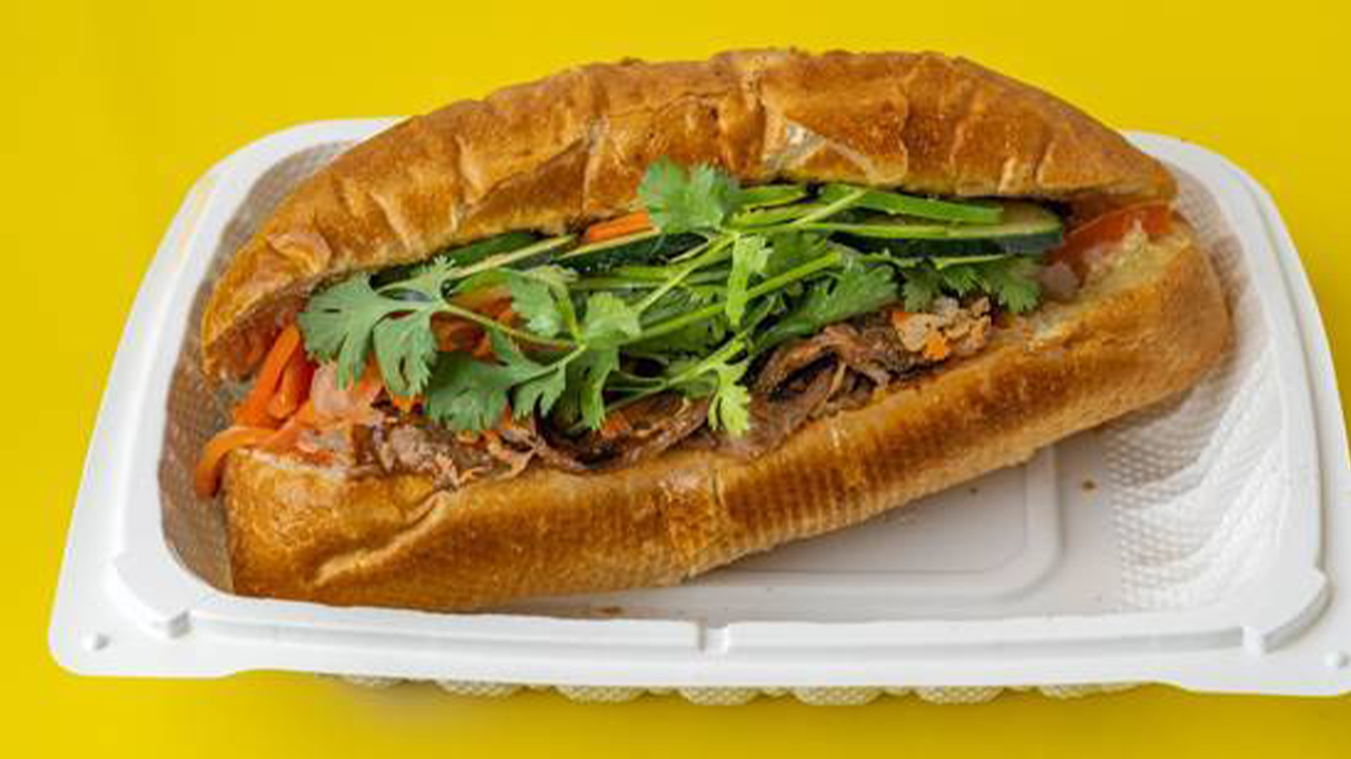 Big-Boss-Banh-Mi-Vietnamese-Restaurant-Grill-Pork-Banh-Houston Grilled pork banh mi with veggies, cilantro at Big Boss Banh Mi, a Vietnamese Restaurant in Houston