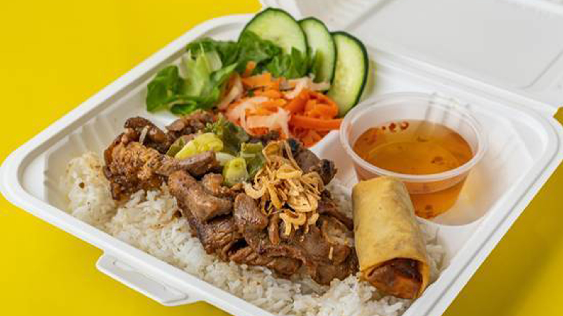 Big-Boss-Banh-Mi-Vietnamese-Restaurant-Grill-Pork-Rice-Box-Houston Grilled pork over rice, veggies, egg roll at Big Boss Banh Mi, a Vietnamese Restaurant in Houston