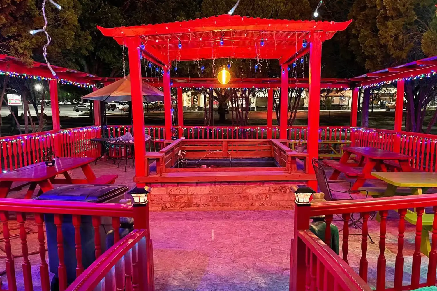 Color‑lit outdoor pavilion dining patio at Beijing Restaurant，a Chinese Restaurant in San Antonio