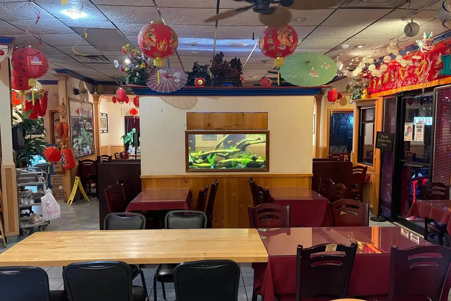 Spacious dining hall decorated with red lanterns and fish tank at Beijing Restaurant，a Chinese Restaurant in San Antonio