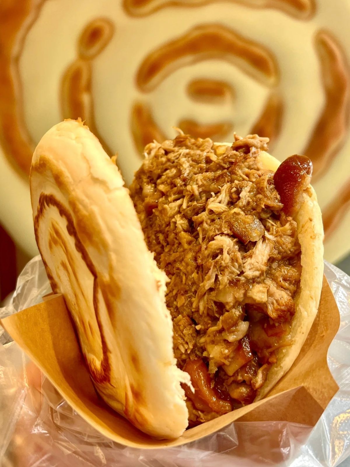Juicy braised pork meat sandwich with soft baked flatbread crust at Bk Hand Pulled Noodles, a Chinese Restaurant in Brooklyn