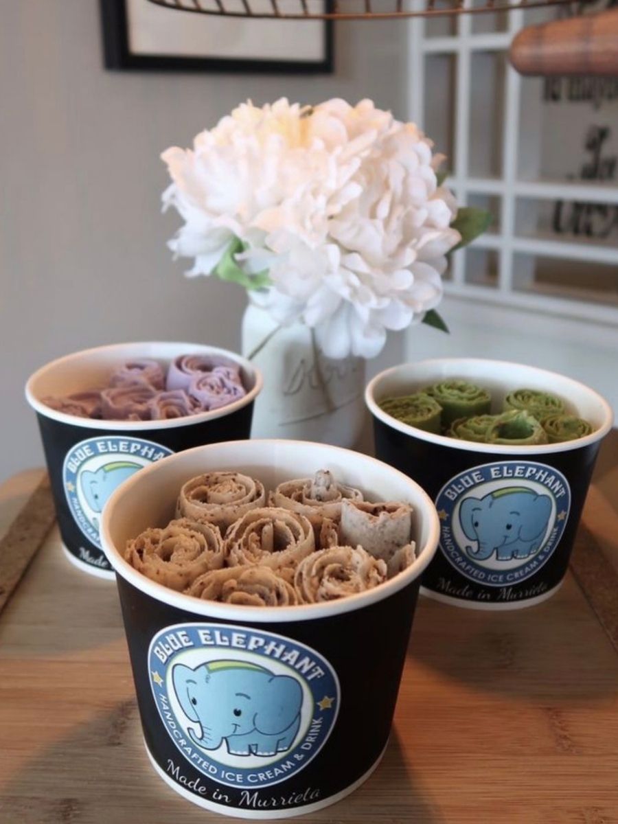 Assorted flavor ice cream rolls in branded cups at Blue Elephant Thai Ice Cream and Drink, a Ice cream shop in Murrieta