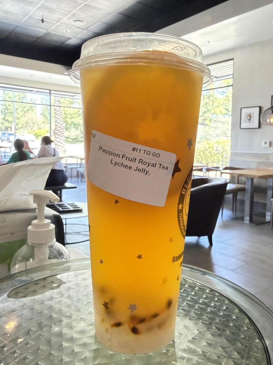 Blue Elephant branded fruit tea cup with star patterns at Blue Elephant Thai Ice Cream and Drink, a Ice cream shop in Murrieta