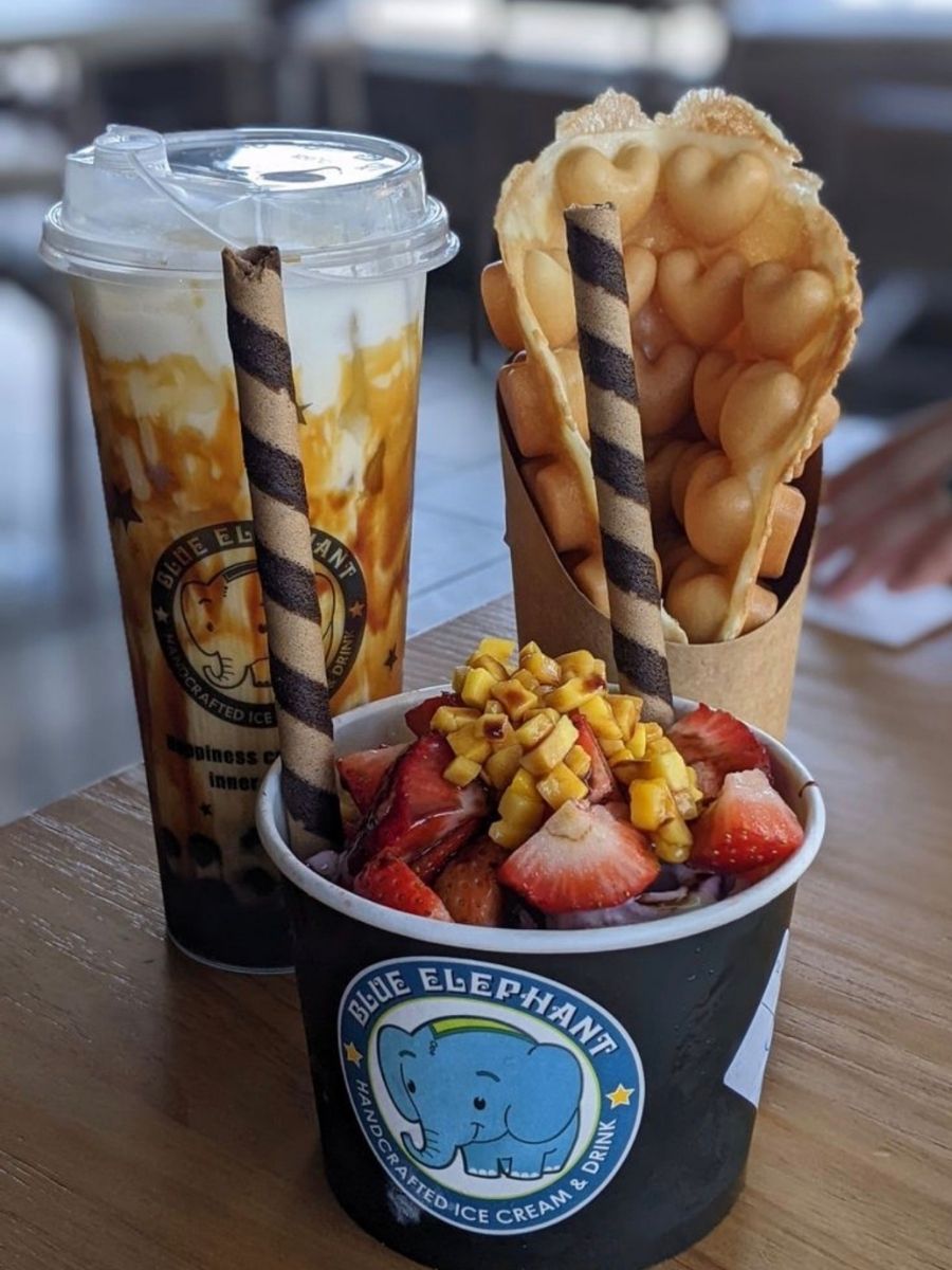 Fruit-topped ice cream cup with boba drink and waffle at Blue Elephant Thai Ice Cream and Drink, a Ice cream shop in Murrieta