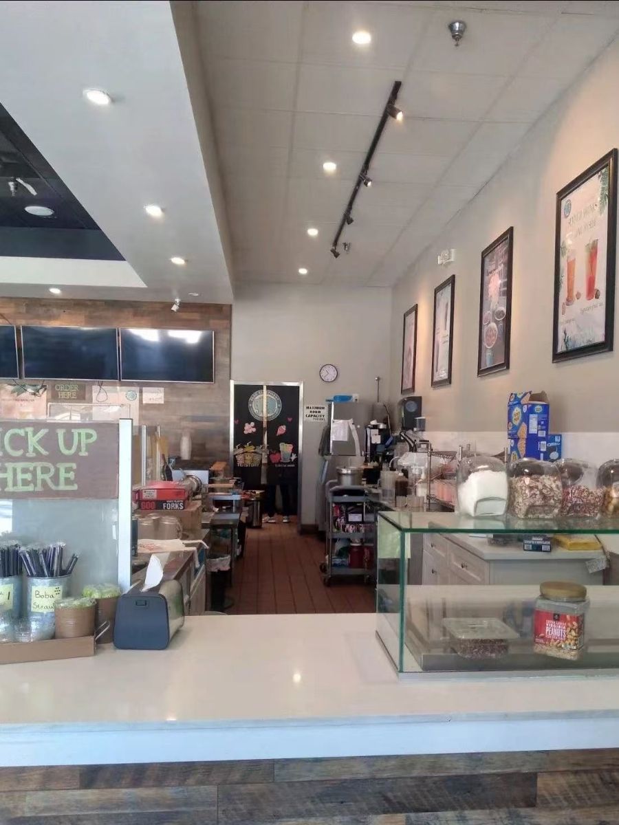 Interior counter area with drink dispensers at Blue Elephant Thai Ice Cream and Drink, a Ice cream shop in Murrieta
