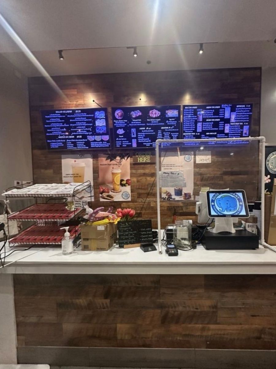Order counter with menu boards and payment terminal at Blue Elephant Thai Ice Cream and Drink, a Ice cream shop in Murrieta