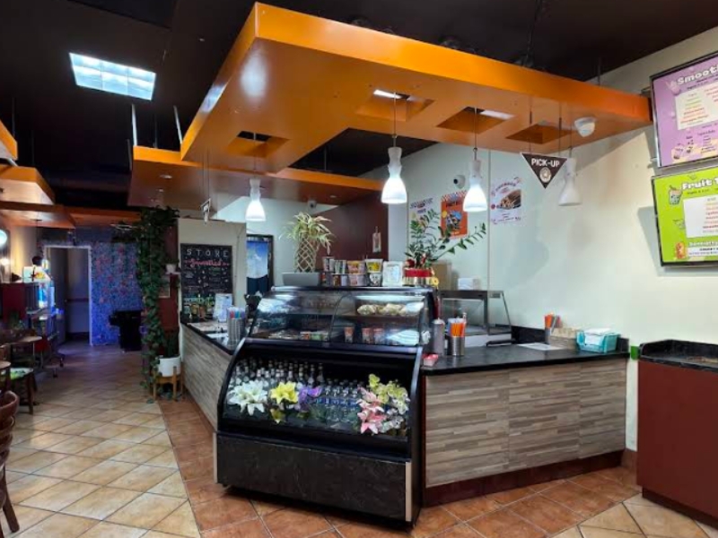 Bright cafe interior with counter and menu boards at Boba Loca, a Cafe in Valley Glen