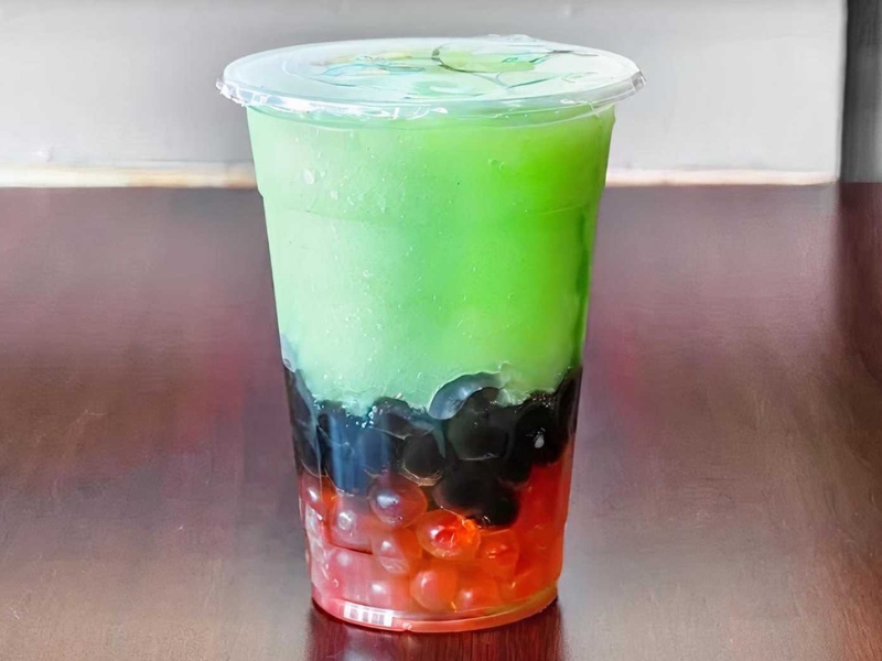 Vibrant layered green and red boba drink at Boba Loca, a Cafe in Valley Glen