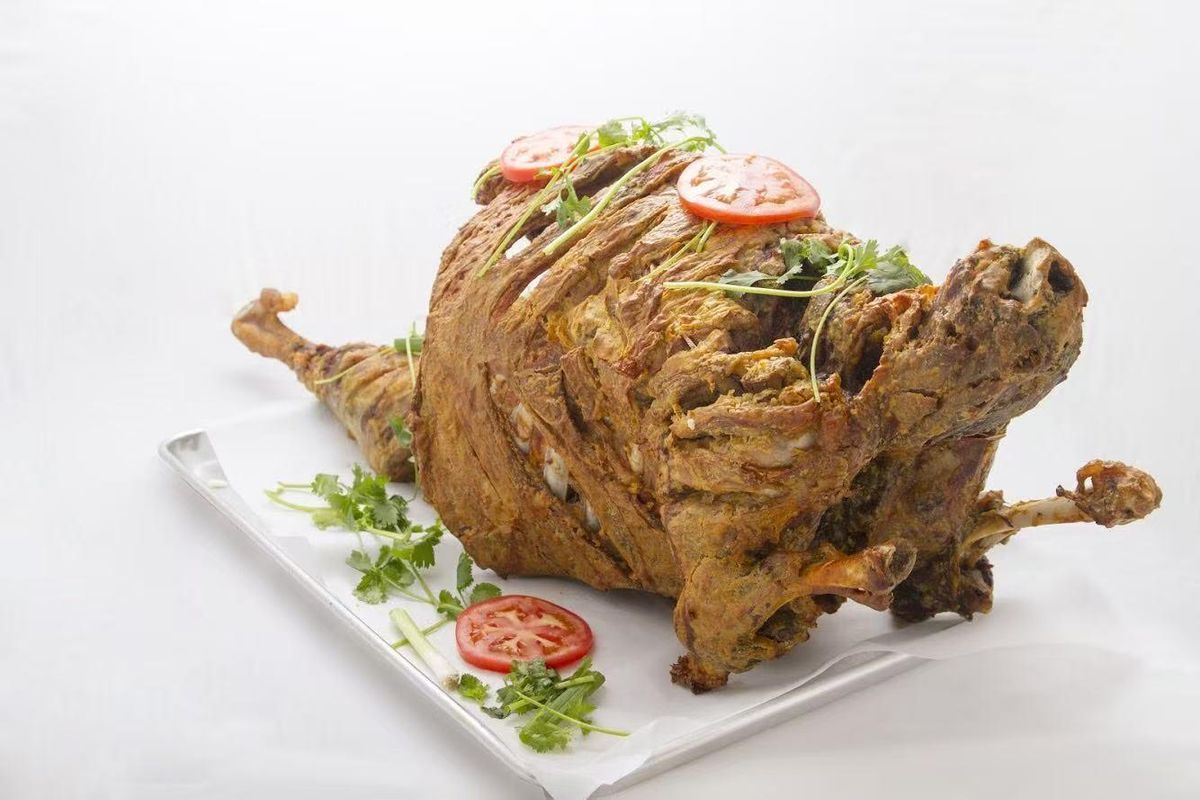 Whole roasted lamb with herbs at Bogda Uyghur Restaurant, a Chinese Halal Restaurant in Plano