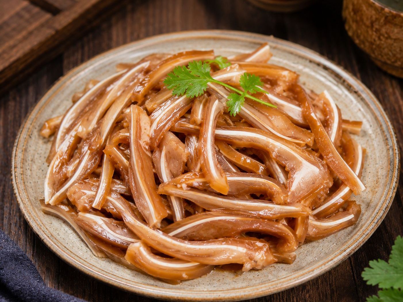 Sliced marinated pig ears garnished with fresh cilantro at Braised Canaan, a Chinese Restaurant in Flushing