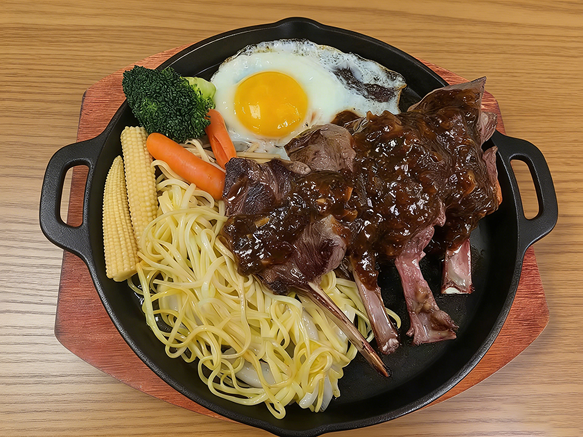 Grilled lamb chops with spaghetti, fried egg and vegetables at Bull King Steak House，a Asian Fusion Steakhouse in Glendale