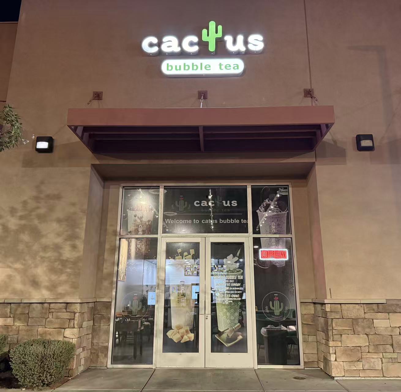 Night‑time front entrance of Cactus bubble tea shop