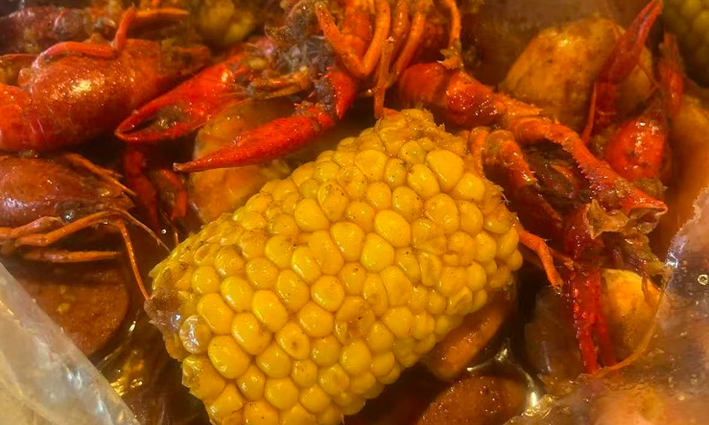 Spicy crawfish boil with corn and potatoes at Cajun Bros, a Seafood Restaurant in Waxahachie