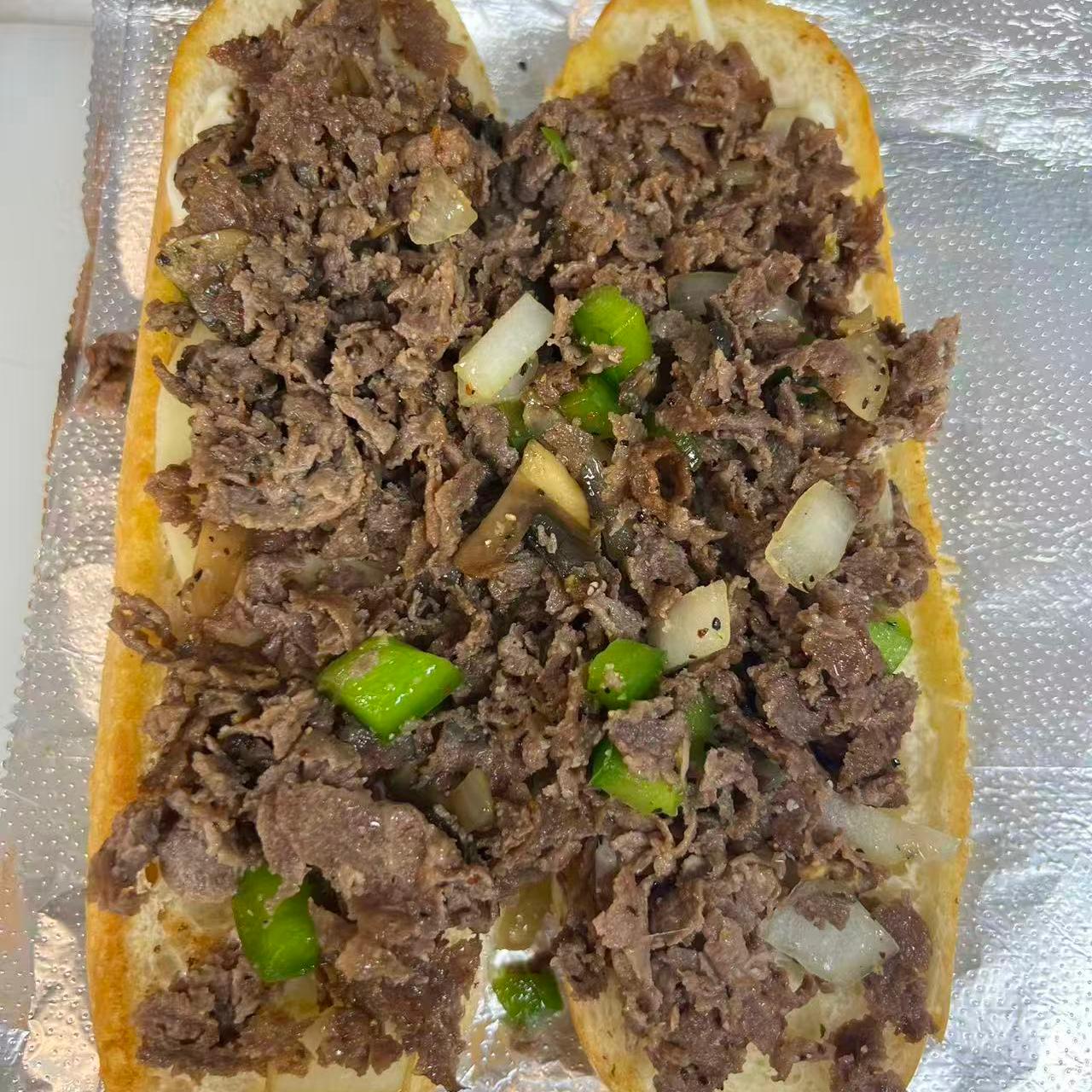 Philly cheesesteak sandwich with beef, veggies and cheese at Cajun Claws & Wing, a Seafood Restaurant in Hartsville