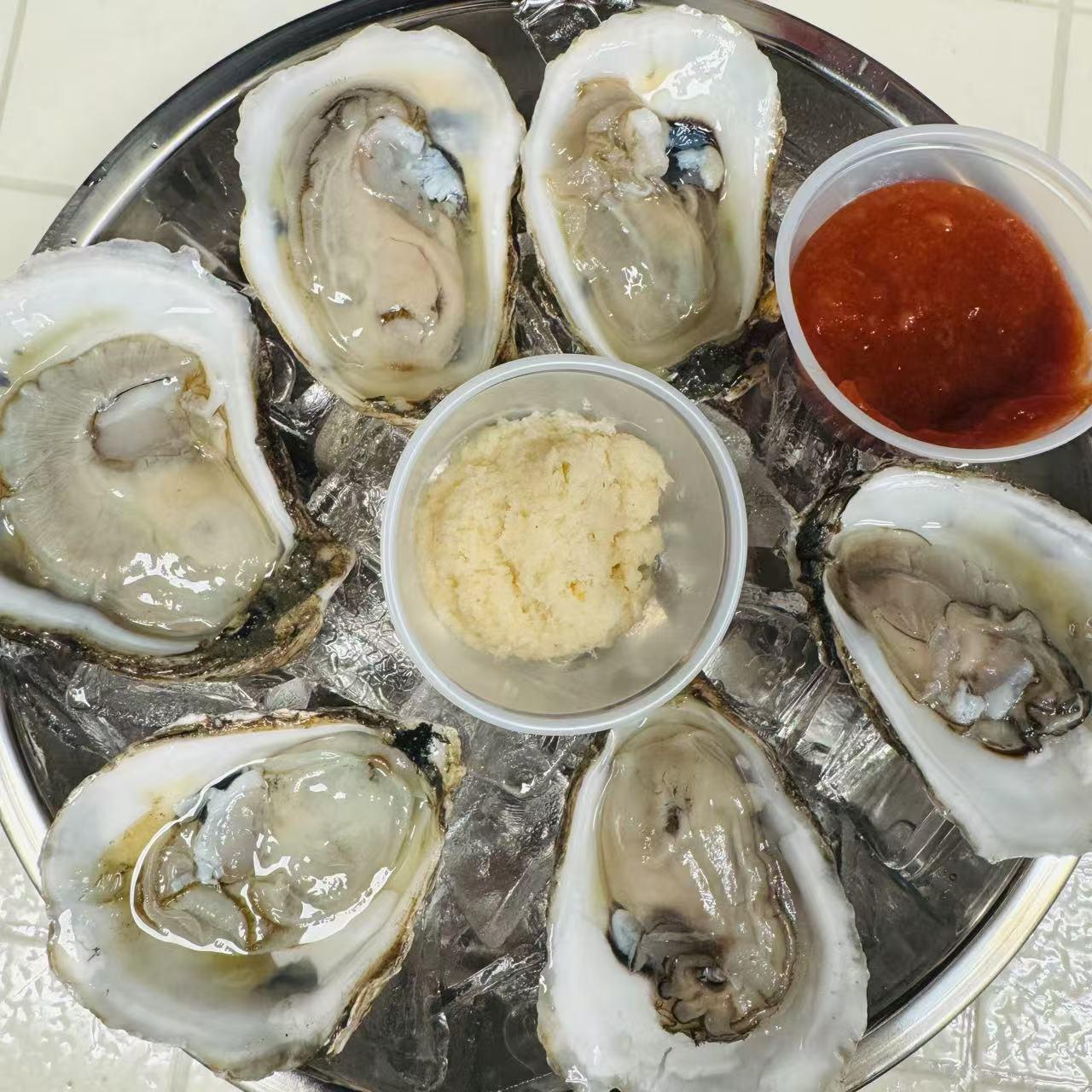 Cajun-Corner-seafood-restaurant-Raw-Oysters-Fries-Everett Raw Oysters Fresh raw oysters with garlic and cocktail sauce at Cajun Corner, a seafood Restaurant in Everett
