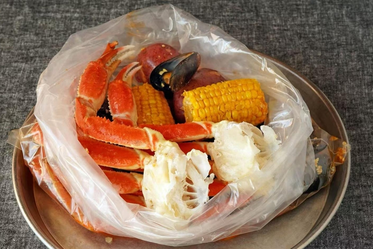 Boiled snow crab legs with corn and potato at Cajun Express, a Seafood Restaurant in St Paul