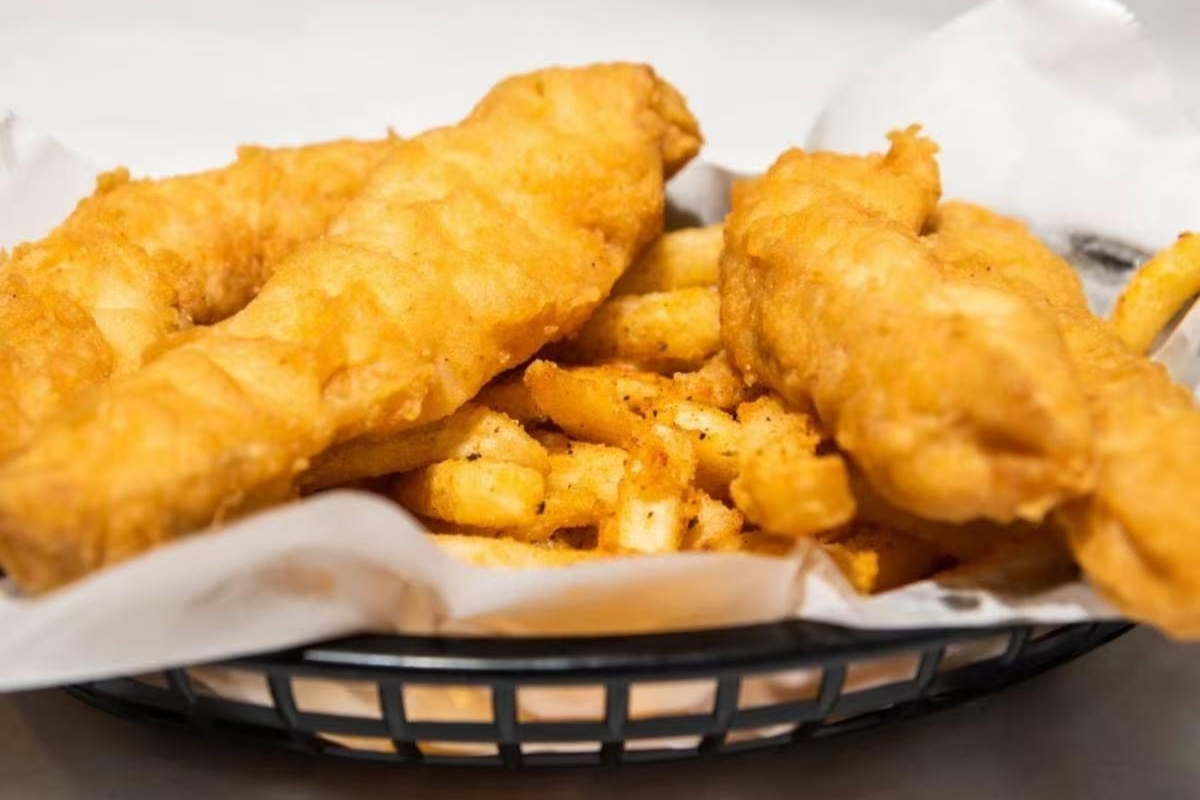 Crispy fried chicken tenders with seasoned fries at Cajun Express, a Seafood Restaurant in St Paul