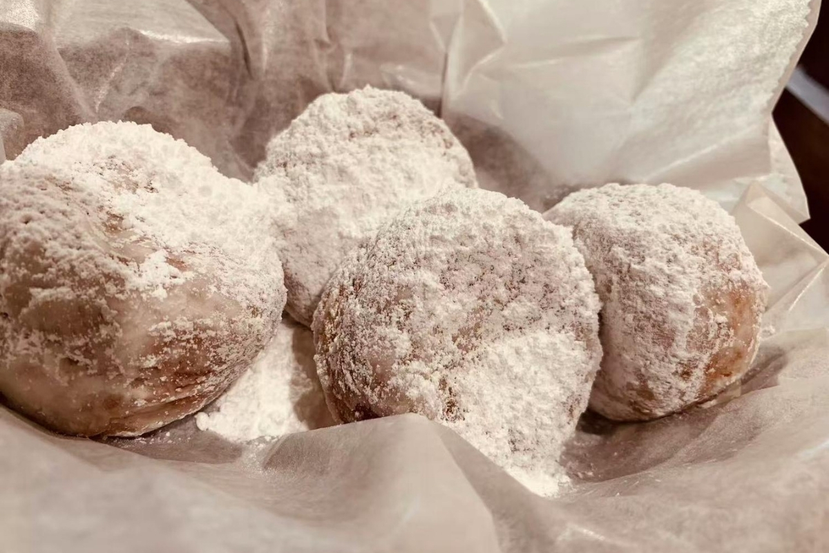Fried pastries dusted with powdered sugar at Cajun Express, a Seafood Restaurant in St Paul