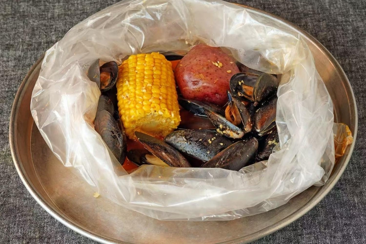 Steamed mussels with corn and potato at Cajun Express, a Seafood Restaurant in St Paul