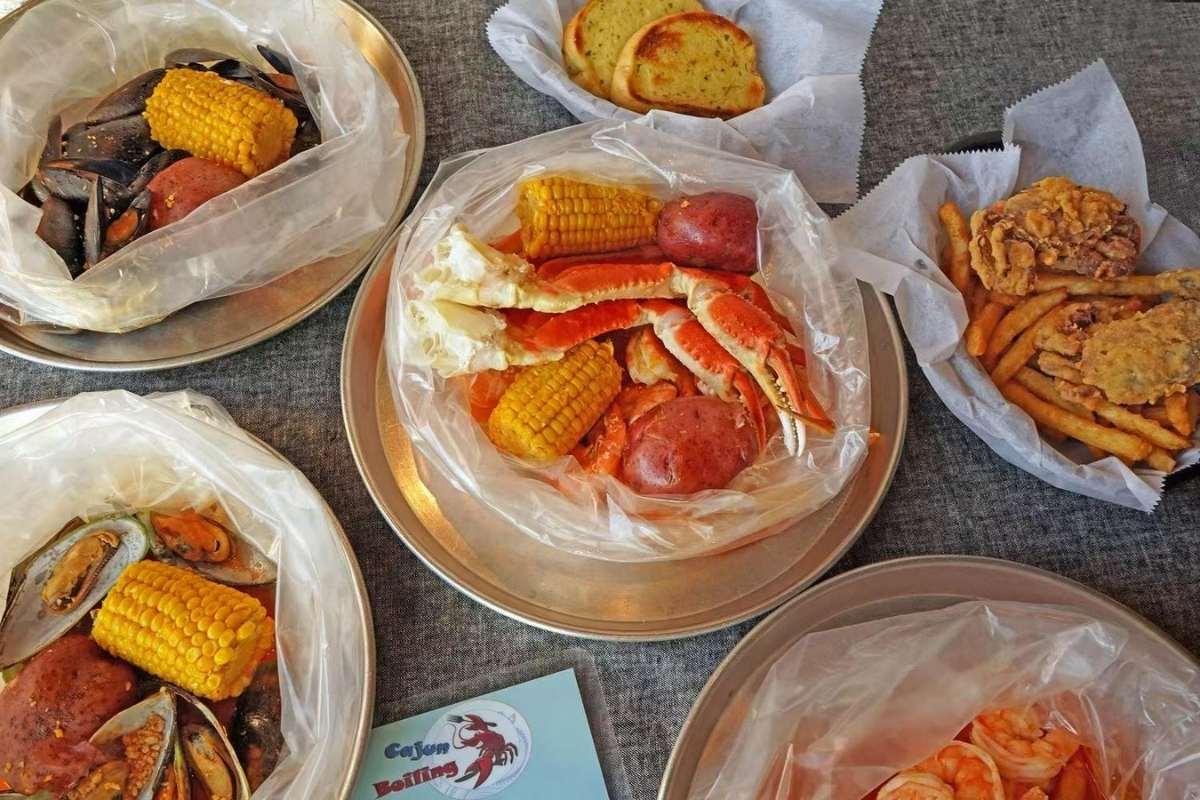 Various seafood boil packs and fried snacks at Cajun Express, a Seafood Restaurant in St Paul