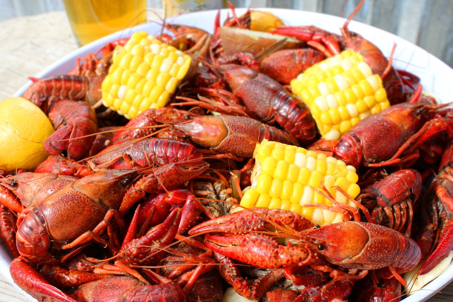 Spicy boiled crawfish served with corn, potatoes and lemon at Cajun Wild Crab,a Seafood Restaurant in Valdosta Spicy boiled crawfish served with corn, potatoes and lemon at Cajun Wild Crab,a Seafood Restaurant in Valdosta
