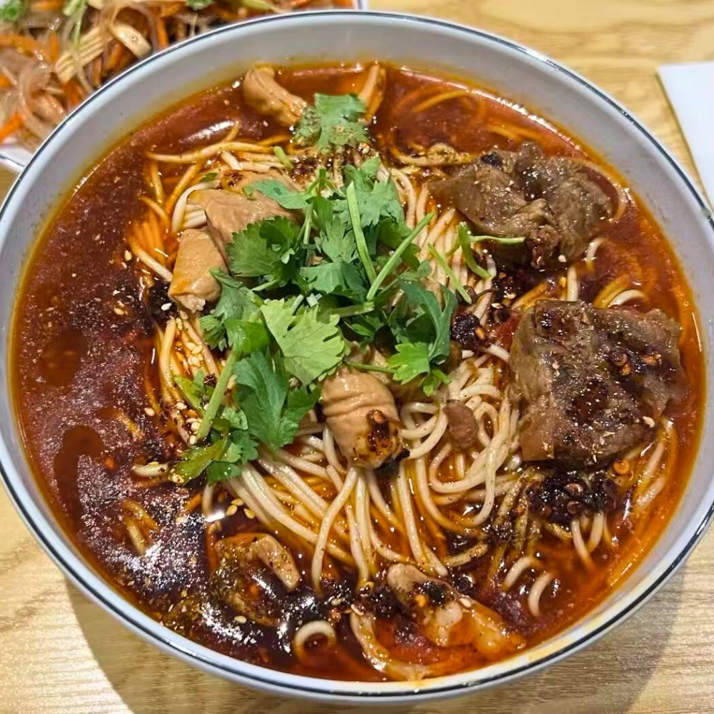 Spicy pork intestine and beef noodle soup at Cal's Noodle Hut, a Chinese Noodle Restaurant in Calgary