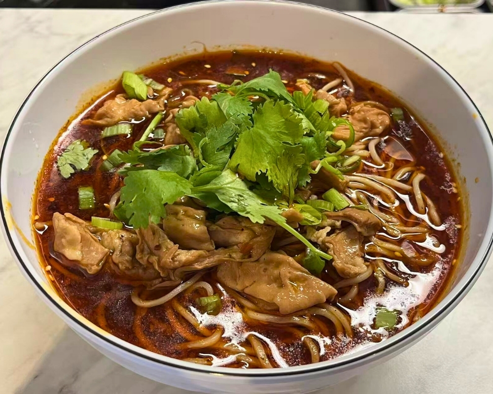 Spicy pork intestine noodle soup at Cal's Noodle Hut, a Chinese Noodle Restaurant in Calgary
