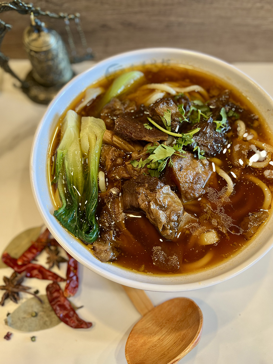 CA-Noodle-Chinese-Restaurant-Braised-Beef-Noodles-Pleasanton A bowl of Braised Beef Noodles with tender beef and green vegetables at CA Noodle, a Chinese Restaurant in Pleasanton
