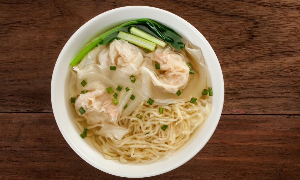 Wonton noodle soup with shrimp dumplings, noodles, and leafy greens at Canto House, a Chinese restaurant in Philadelphia