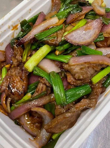 Stir-fried pork with onions and scallions in a savory sauce at Canto House, a Chinese restaurant in Philadelphia