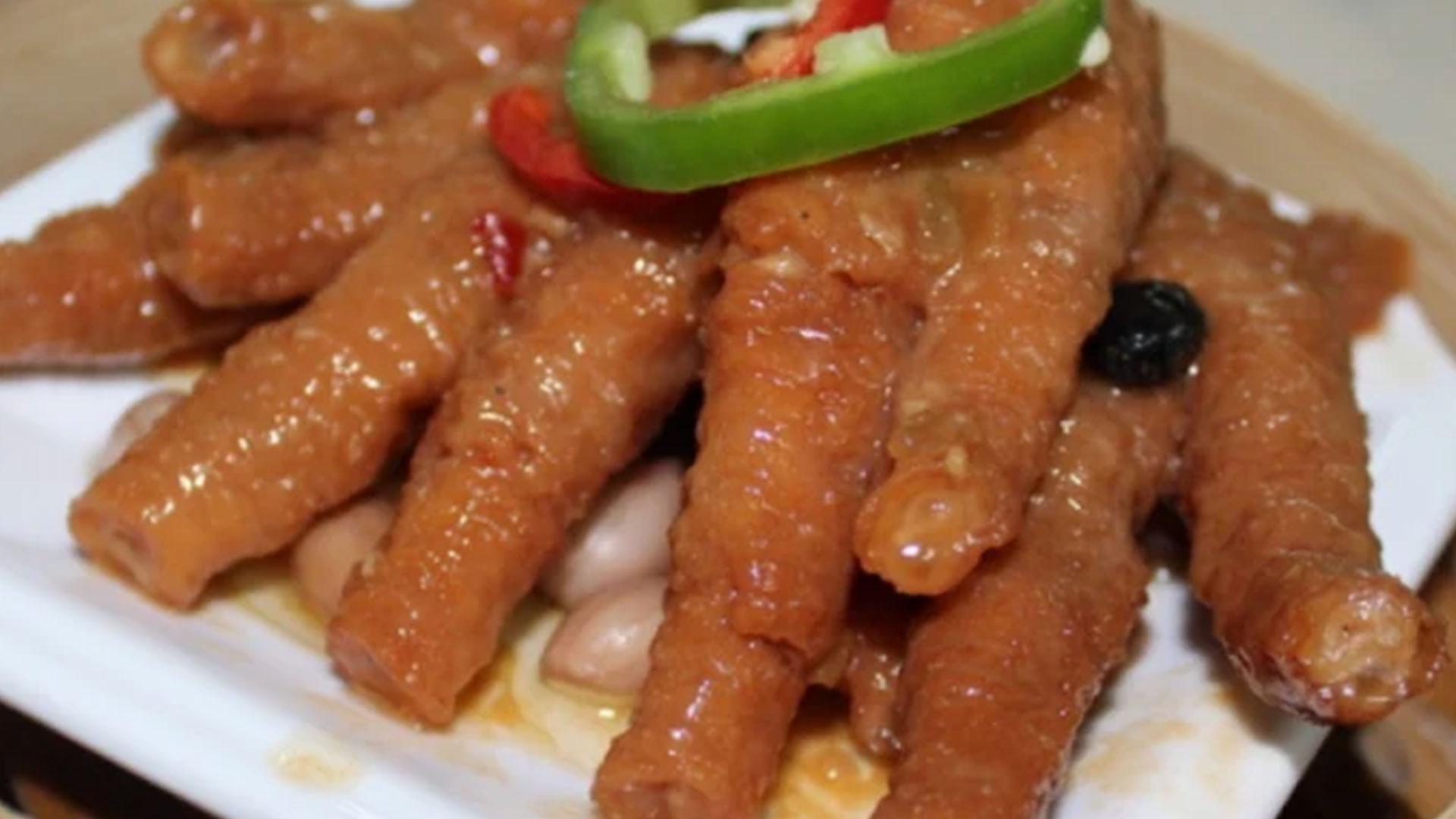 Braised chicken feet in savory sauce with peanuts and chili at Canto House, a Chinese restaurant in Philadelphia Braised chicken feet in savory sauce with peanuts and chili at Canto House, a Chinese restaurant in Philadelphia