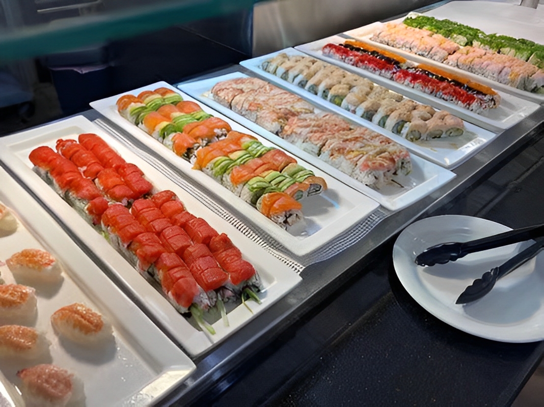 Sushi Buffet Assorted sushi rolls at a self - service sushi bar at Captain Buffet, a Asian Fusion restaurant in Sacramento