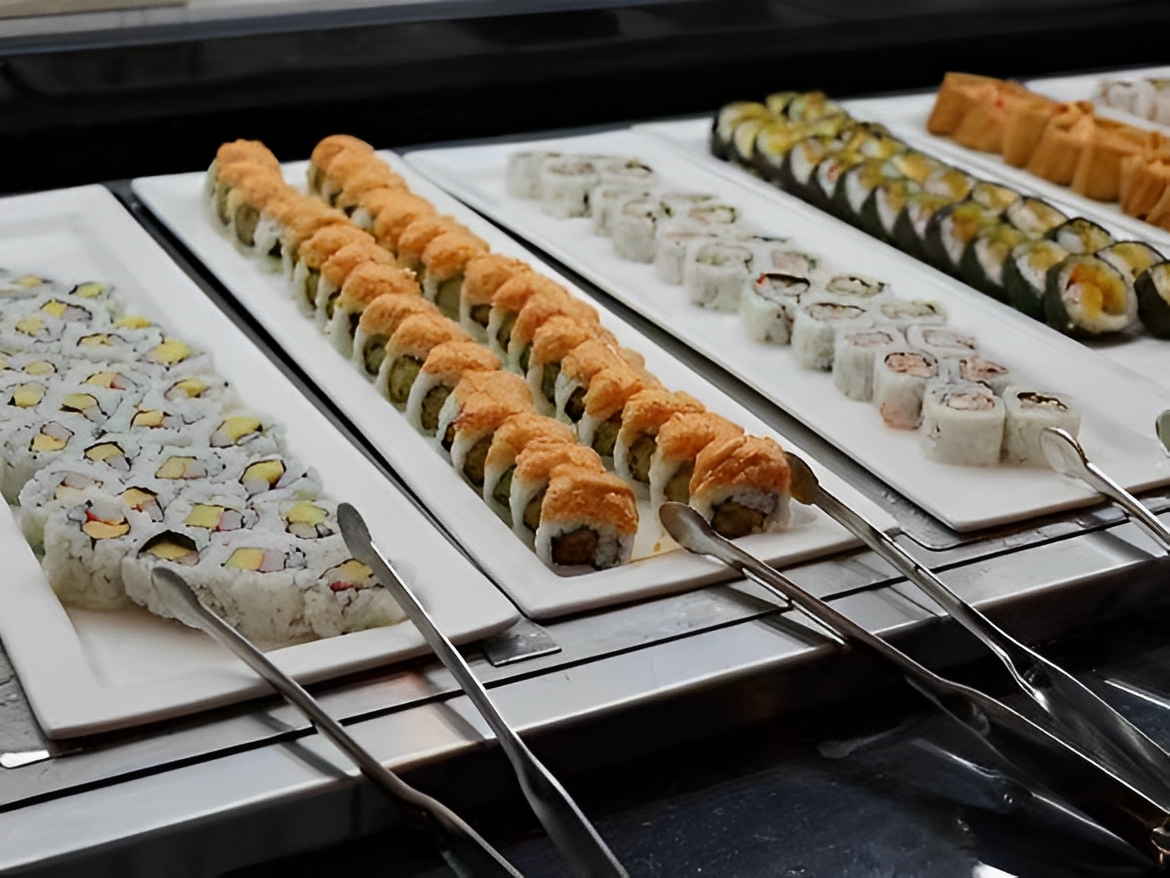 Assorted Sushi Varied sushi rolls on white plates at Captain Buffet, a Asian Fusion restaurant in Sacramento
