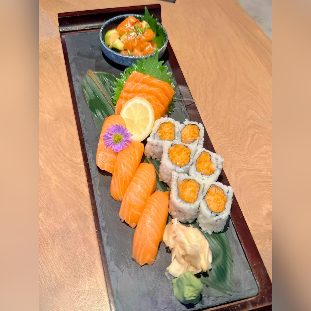 Salmon served as sashimi, sushi, maki, and tartare, with wasabi and ginger at Catzuneko Shokudo, a Japanese Restaurant in New York