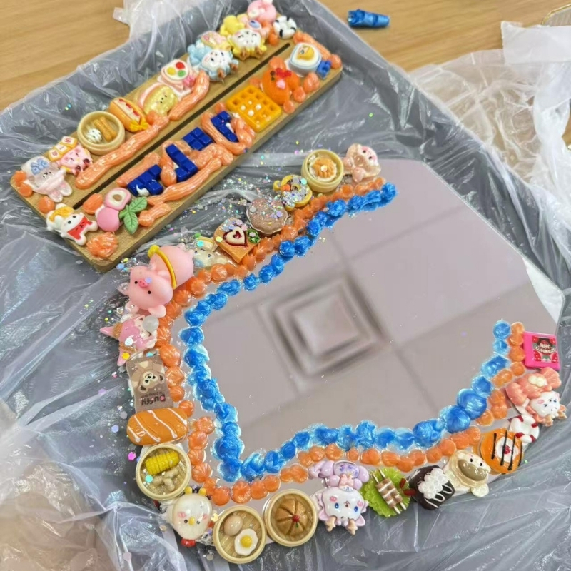 Heart-shaped DIY mirror with colorful charms at Cha Cha Boba Tea Shoppe, a Bubble tea store in Little Rock