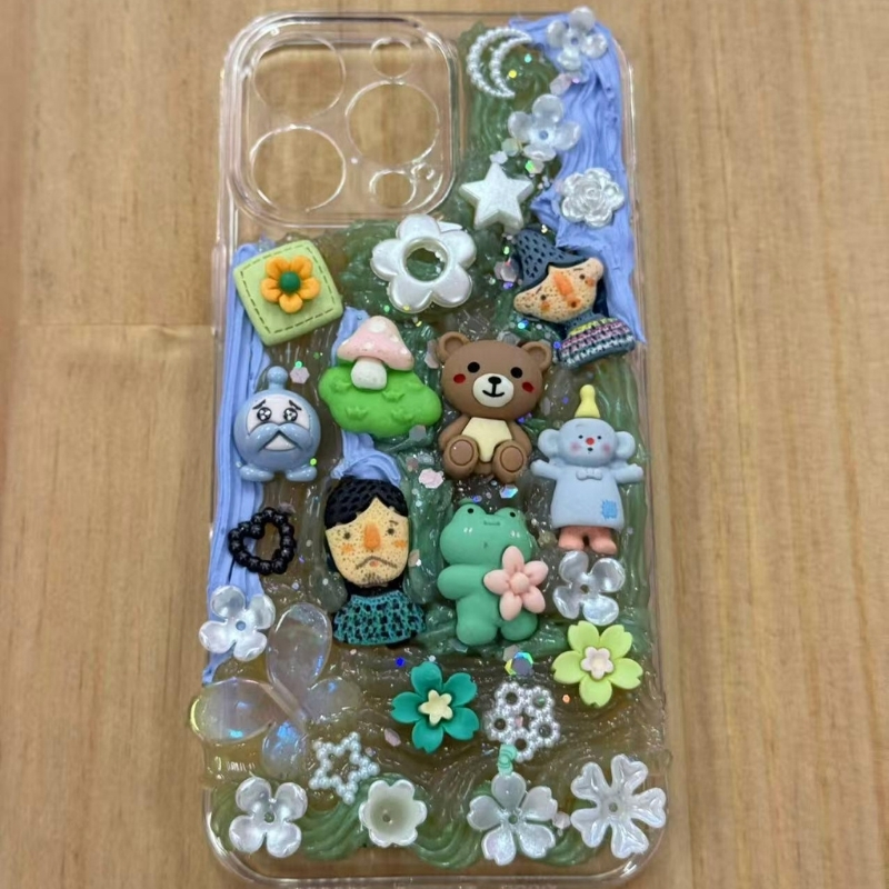 Green and blue DIY phone case with cute charms at Cha Cha Boba Tea Shoppe, a Bubble tea store in Little Rock
