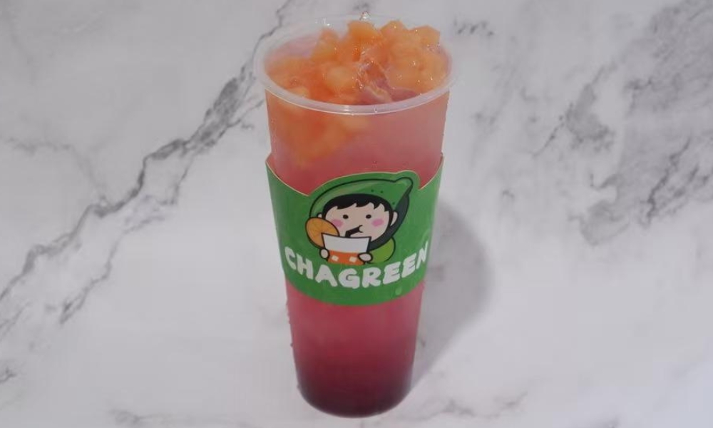 Refreshing peach and dragon fruit green tea with ice at Chagreen tea, a Bubble tea store in Wantagh.