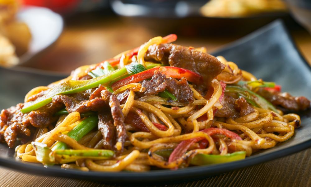 Spicy beef udon noodles with bell peppers, onions, and savory sauce at Chef Ben Asian Cuisine & Ramen, a Asian fusion restaurant in Friendswood