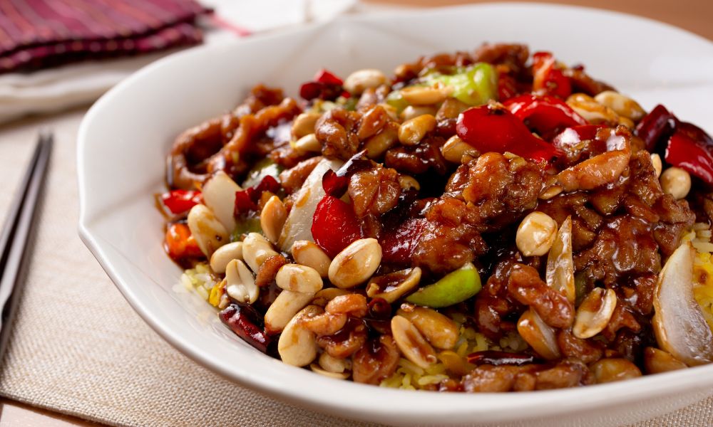 Kung Pao chicken with peanuts, chili peppers, and vegetables over rice at Chef Ben Asian Cuisine & Ramen, a Asian fusion restaurant in Friendswood