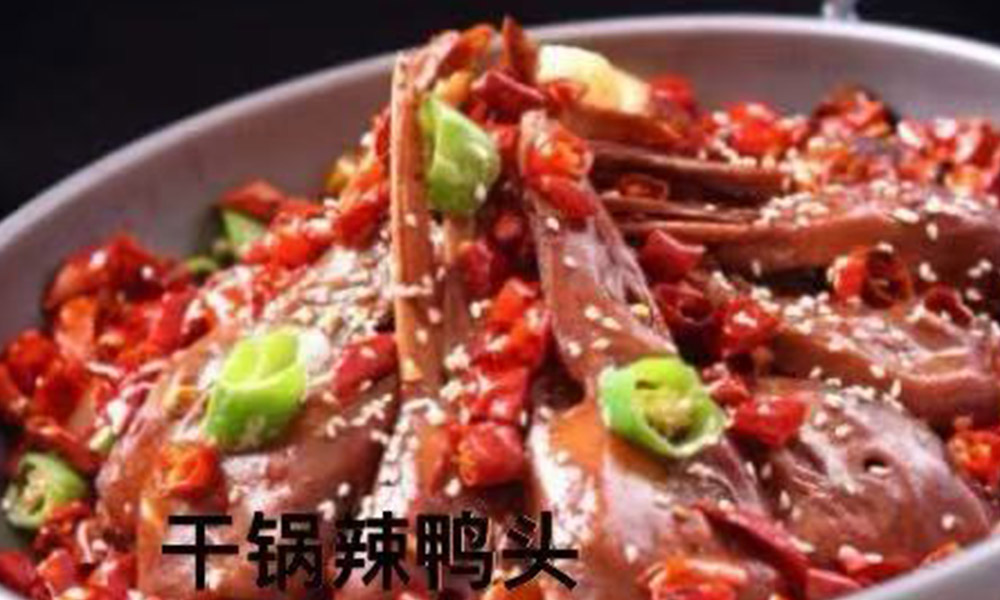 Spicy duck heads in dry pot, loaded with chili peppers and sesame seeds at Chef Ge, a Chinese Restaurant in Highland Park