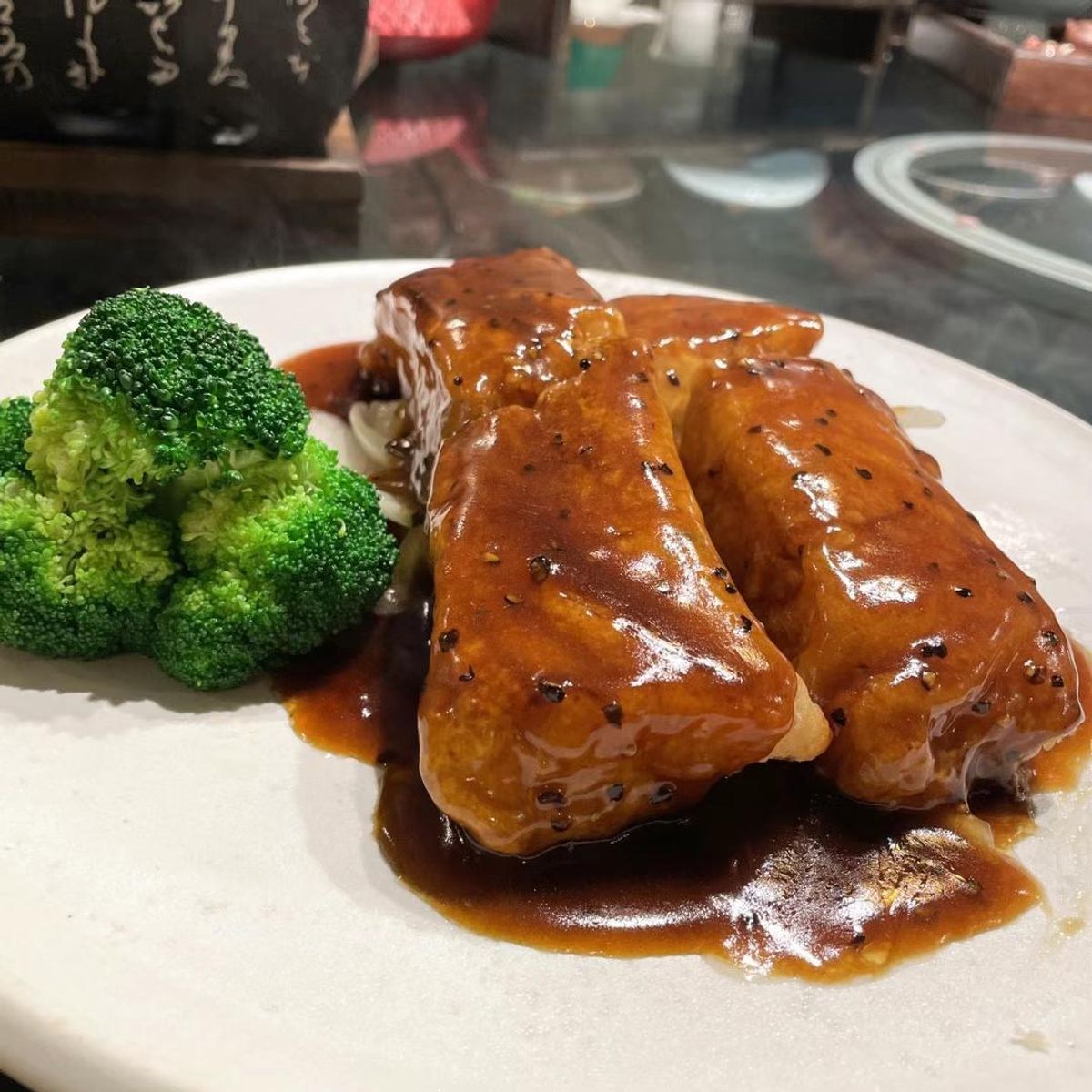Braised meat in glossy sauce with broccoli at Chef Huang, a Chinese Restaurant in New York