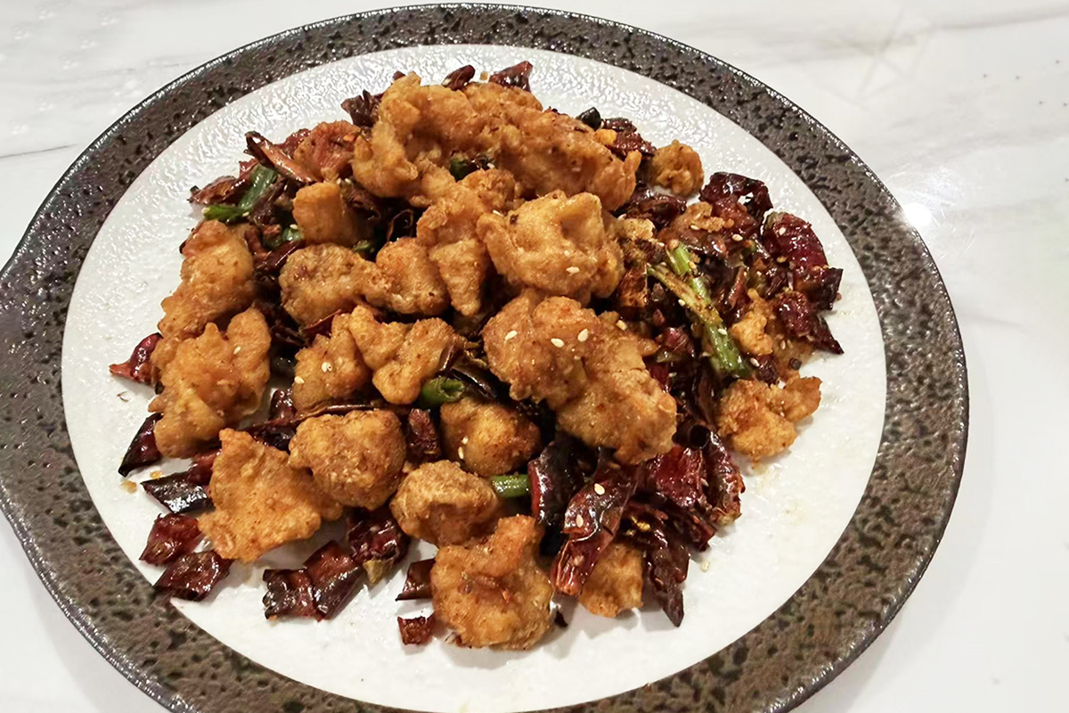 Chicken cartilage with dried chili peppers, Sichuan peppercorns, scallionsand garlic-the ultimate crunchy snack at Chef Ma，a Chinese Restaurant in Edison