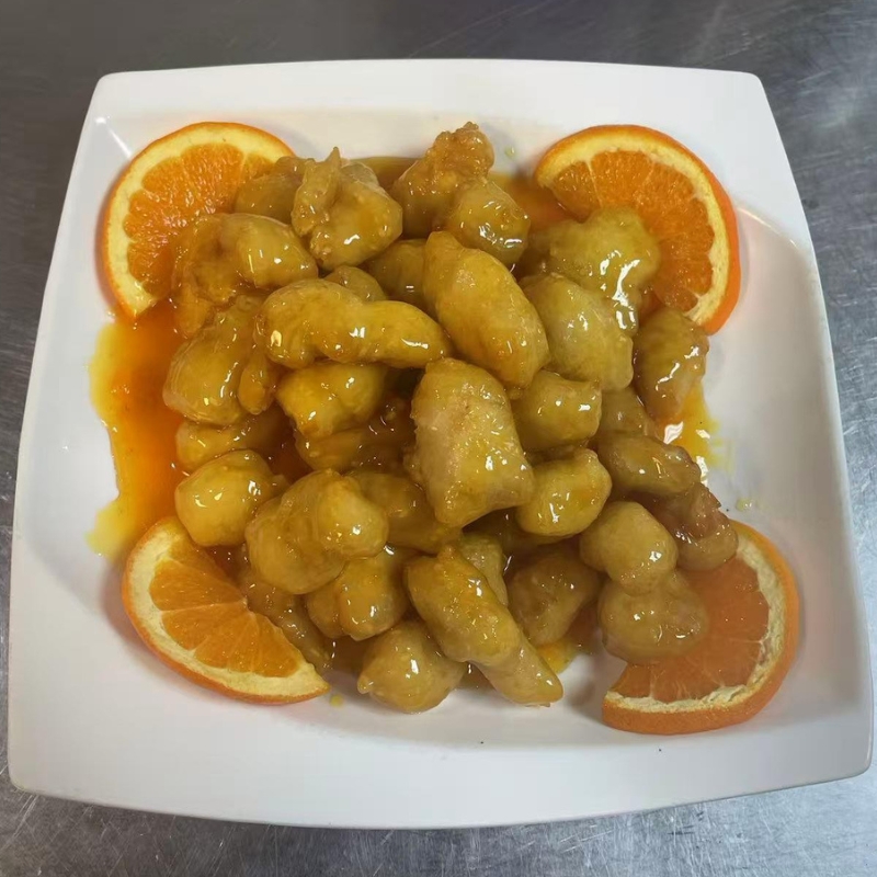 Honey orange chicken chunks with orange slices at Chef Zhao，a Chinese Restaurant in Portland