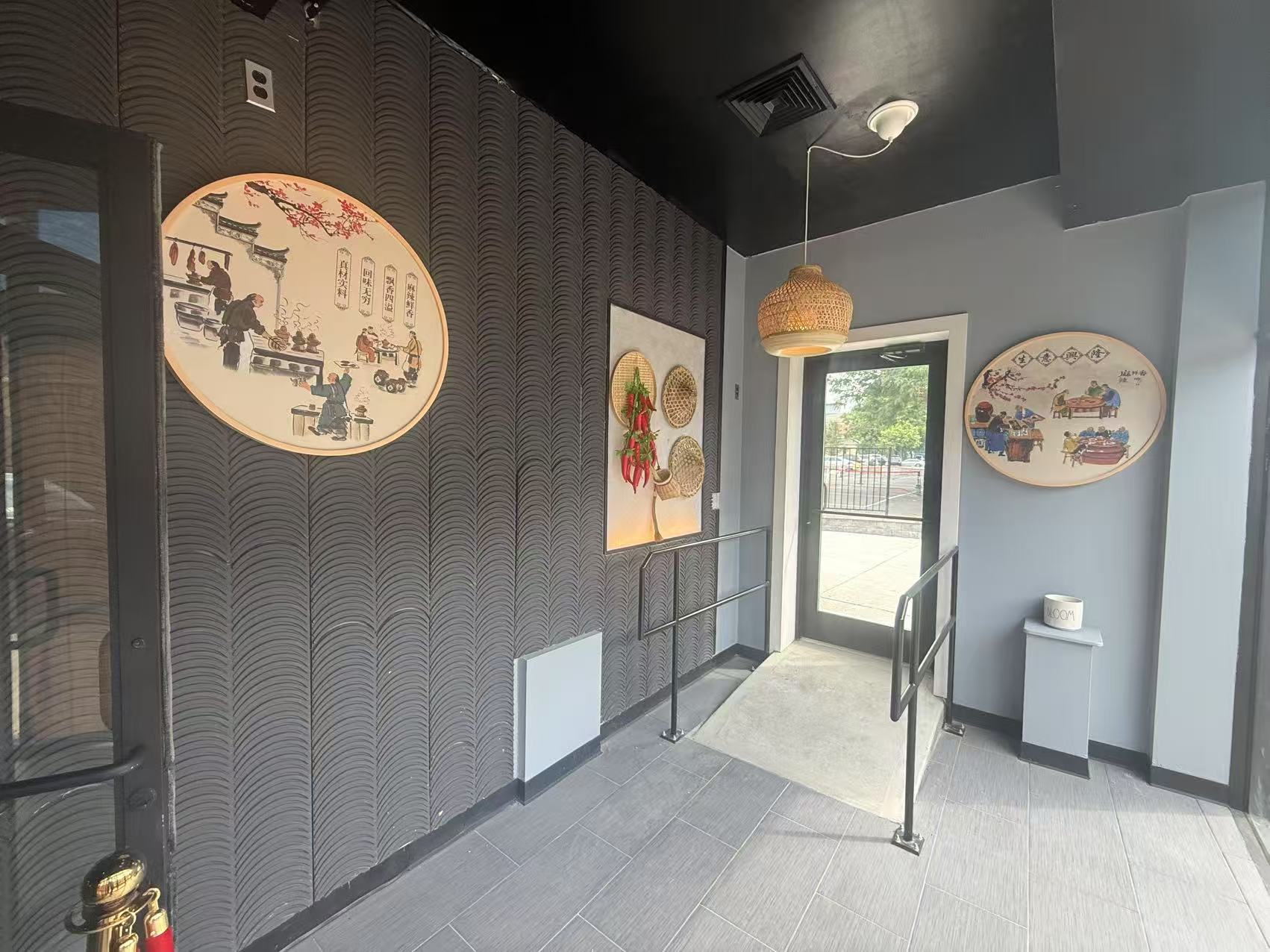 Restaurant entry hallway with traditional Chinese wall art and woven lamp at Chengdu Impression Chinese Restaurant in Schenectady