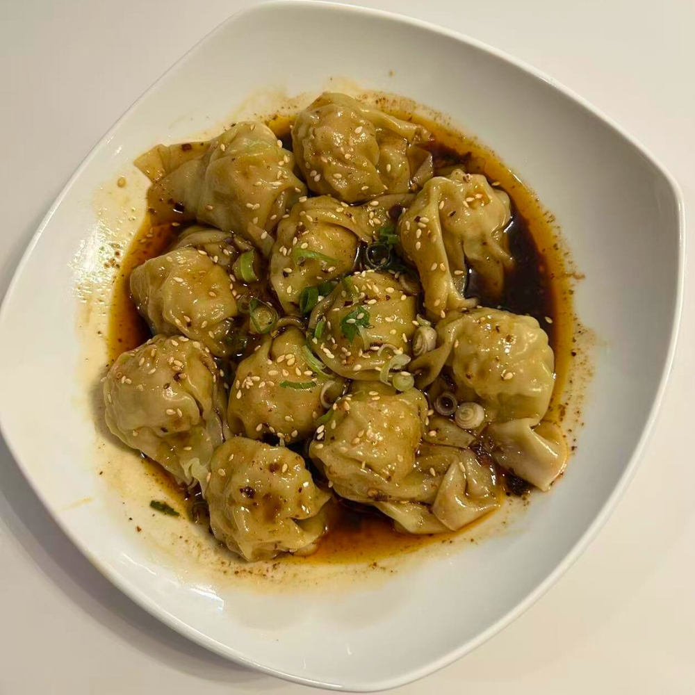 Chen’s-Family-Dish-Six-Wok-&-Bar-Chinese-Restaurant-Dumplings-in-Soy-Sauce-Salem Dumplings topped with soy sauce, sesame seeds, and green onions at Chen's Family Dish Six Wok & Bar, a Chinese Restaurant in Salem