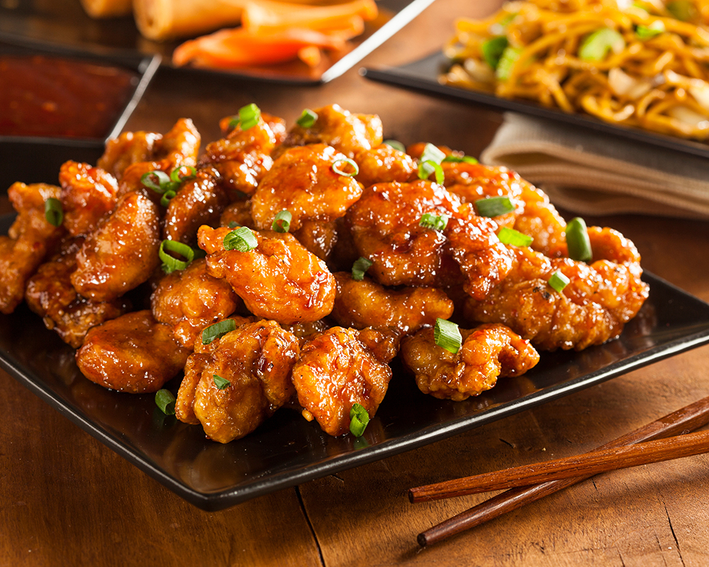 Sticky sweet glazed fried chicken topped with green scallion at Chen’s Wok, a Chinese Restaurant in Crowley Sticky sweet glazed fried chicken topped with green scallion at Chen’s Wok, a Chinese Restaurant in Crowley