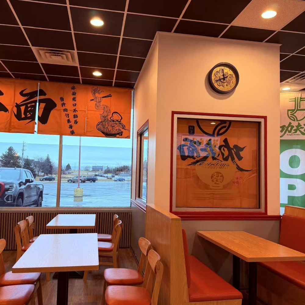 Cozy dining area with wooden tables and Chinese decor at Kung Fu Noodles, a Chinese Noodle Restaurant in Chilton