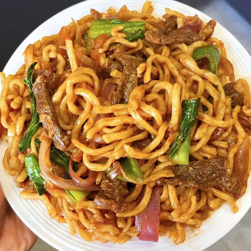 Stir-fried thick noodles with beef and veggies at Kung Fu Noodles, a Chinese Noodle Restaurant in Chilton
