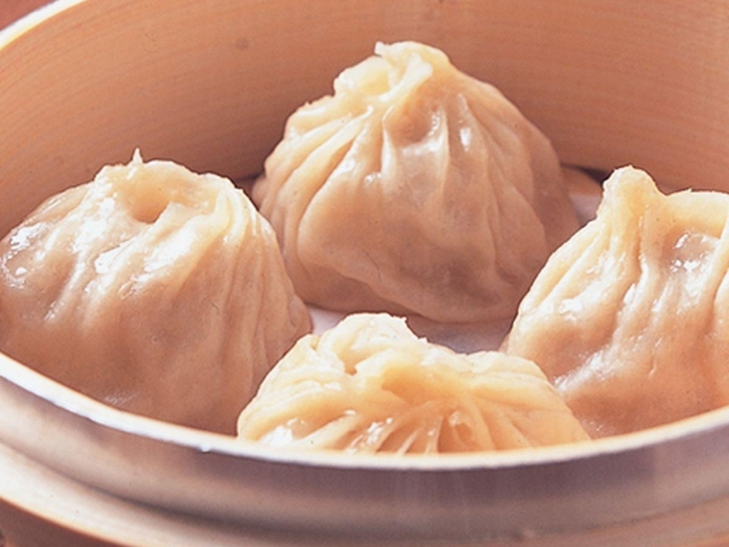 Juicy soup-filled dumplings in bamboo steamer at China Flavor, a Dim Sum Restaurant in Lansing