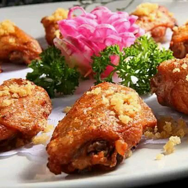 Deep-fried chicken wings with crispy garlic topping at China One, a Chinese Restaurant in Upland